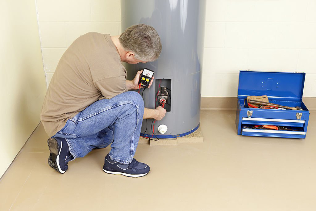 a man fixing a water heater